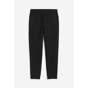 H&M DryMove™ Tapered Tech-Joggpants mit Zippertaschen Schwarz, Sport – Hosen in Größe S. Farbe: Black