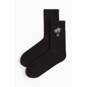 H&M Socken Schwarz/Palmen in Größe 46/48. Farbe: Black/palm trees